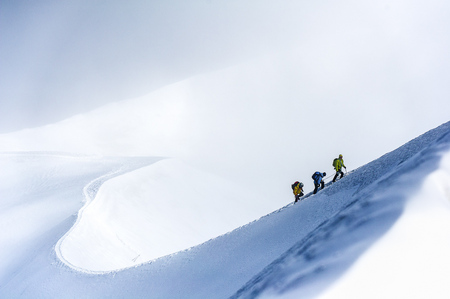 An IVBV mountain guide leads his climbers along snowy arete of Aiguille du Midi., 42 kb An IVBV mountain guide leads his climbers along snowy arete of Aiguille du Midi., 42 kb