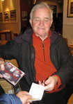 [Dennis Gray, like a market trader, was hawking his latest CD, The Bar Room Mountaineers., 3 kb]