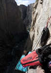 [Ian Wilson setting up the  portaledge on the Hallucinogen Wall, Black Canyon, 3 kb]