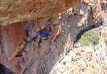 [Dave Birkett chalking up on the crux roof of Remote Control, 3 kb]