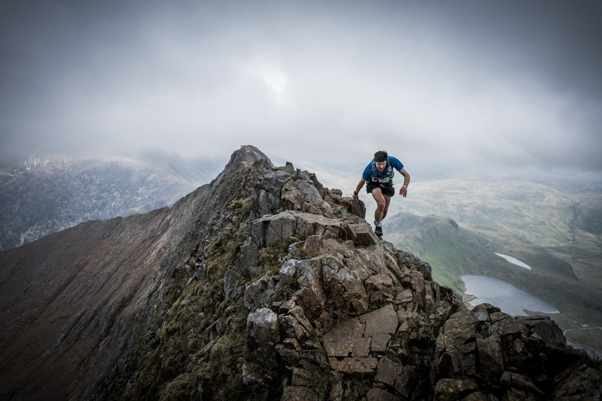 Neil Talbott tackles the infamous Crib Goch ridge on day one of the 2017 Berghaus Dragon's Back Race © @iancorless