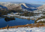 Walker on her way to Loughrigg summit from Grasmere., 4 kb