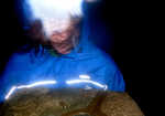 Sally Wheatley, using the TIKKA XP² at the trig point on Helvellyn during a dark and stormy night in December., 3 kb