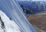 Dave Turnbull climbing the summit ice slopes on the first ascent of Gojung, 4 kb