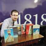 1818 book expert Rob Kerr with six key titles from the collection, 4 kb